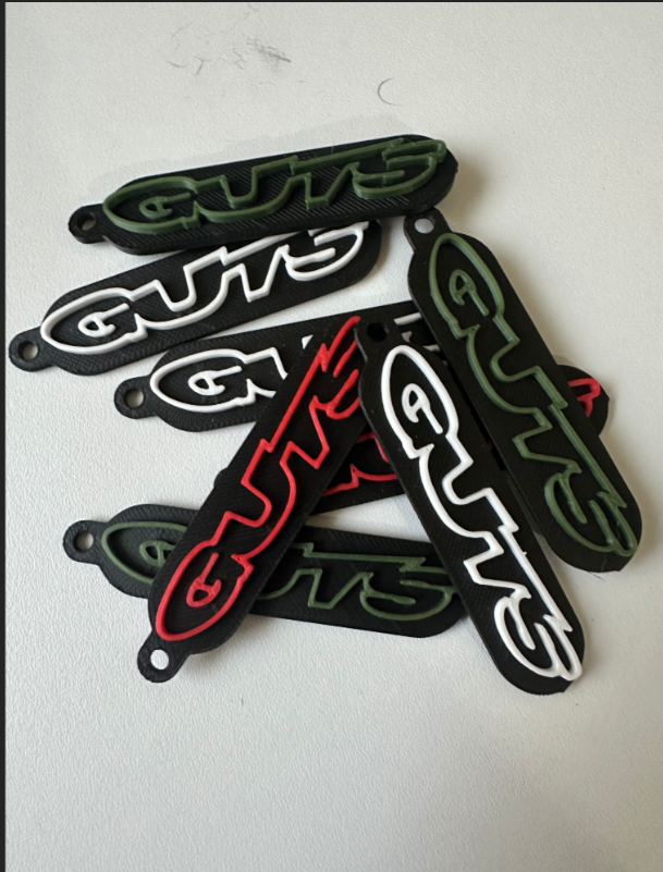Guts racing keychain